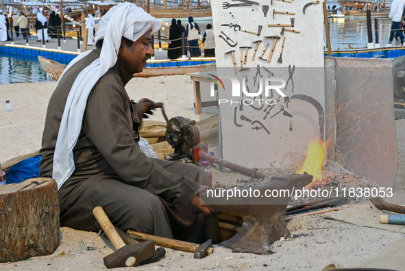 A man makes an anchor during the 14th Katara Traditional Dhow Festival in Katara Cultural Village in Doha, Qatar, on December 5, 2024. The f...