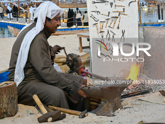 A man makes an anchor during the 14th Katara Traditional Dhow Festival in Katara Cultural Village in Doha, Qatar, on December 5, 2024. The f...