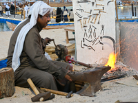 A man makes an anchor during the 14th Katara Traditional Dhow Festival in Katara Cultural Village in Doha, Qatar, on December 5, 2024. The f...