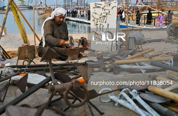 A man makes an anchor during the 14th Katara Traditional Dhow Festival in Katara Cultural Village in Doha, Qatar, on December 5, 2024. The f...