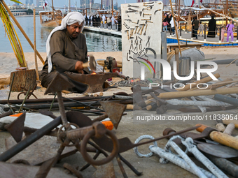 A man makes an anchor during the 14th Katara Traditional Dhow Festival in Katara Cultural Village in Doha, Qatar, on December 5, 2024. The f...