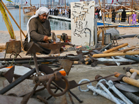 A man makes an anchor during the 14th Katara Traditional Dhow Festival in Katara Cultural Village in Doha, Qatar, on December 5, 2024. The f...