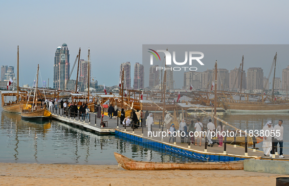 People visit the 14th Katara Traditional Dhow Festival in Katara Cultural Village in Doha, Qatar, on December 5, 2024. The festival celebrat...