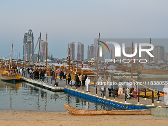 People visit the 14th Katara Traditional Dhow Festival in Katara Cultural Village in Doha, Qatar, on December 5, 2024. The festival celebrat...