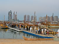 People visit the 14th Katara Traditional Dhow Festival in Katara Cultural Village in Doha, Qatar, on December 5, 2024. The festival celebrat...