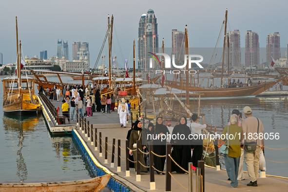 People visit the 14th Katara Traditional Dhow Festival in Katara Cultural Village in Doha, Qatar, on December 5, 2024. The festival celebrat...