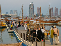 People visit the 14th Katara Traditional Dhow Festival in Katara Cultural Village in Doha, Qatar, on December 5, 2024. The festival celebrat...