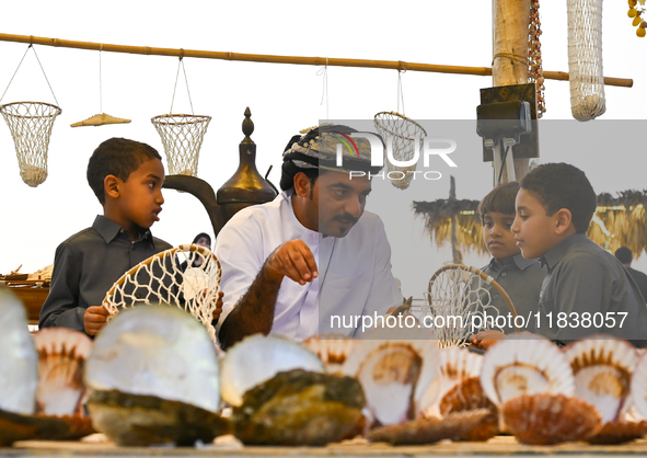 A man makes an oyster basket during the 14th Katara Traditional Dhow Festival in Katara Cultural Village in Doha, Qatar, on December 5, 2024...