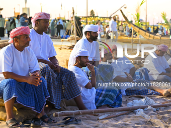 Traditional Arabic fishermen rest after a performance at the 14th Katara Traditional Dhow Festival at Katara Cultural Village in Doha, Qatar...