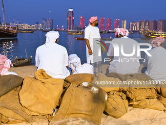 Traditional Arabic fishermen rest after a performance at the 14th Katara Traditional Dhow Festival at Katara Cultural Village in Doha, Qatar...