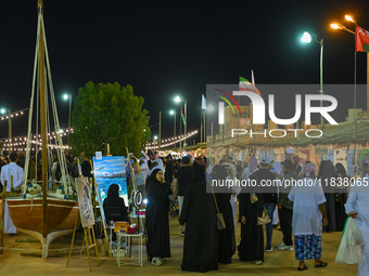 People visit the 14th Katara Traditional Dhow Festival in Katara Cultural Village in Doha, Qatar, on December 5, 2024. The festival celebrat...