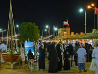 People visit the 14th Katara Traditional Dhow Festival in Katara Cultural Village in Doha, Qatar, on December 5, 2024. The festival celebrat...