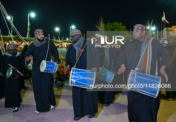 An Omani folk band performs during the 14th Katara Traditional Dhow Festival in Katara Cultural Village in Doha, Qatar, on December 5, 2024....