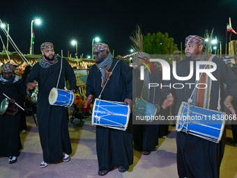 An Omani folk band performs during the 14th Katara Traditional Dhow Festival in Katara Cultural Village in Doha, Qatar, on December 5, 2024....