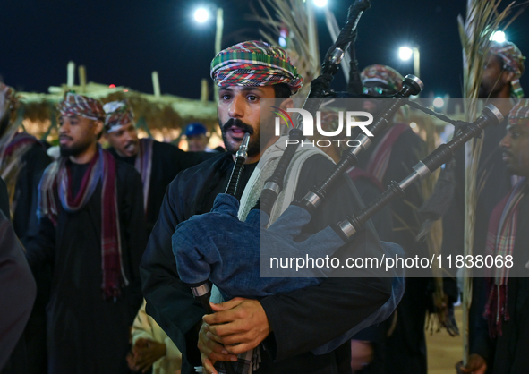 An Omani folk band performs during the 14th Katara Traditional Dhow Festival in Katara Cultural Village in Doha, Qatar, on December 5, 2024....