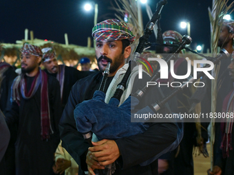 An Omani folk band performs during the 14th Katara Traditional Dhow Festival in Katara Cultural Village in Doha, Qatar, on December 5, 2024....