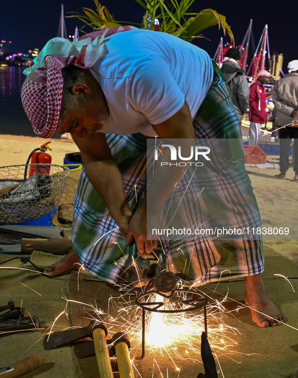 A man makes an anchor during the 14th Katara Traditional Dhow Festival in Katara Cultural Village in Doha, Qatar, on December 5, 2024. The f...