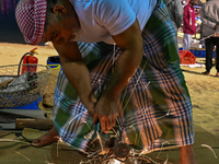 A man makes an anchor during the 14th Katara Traditional Dhow Festival in Katara Cultural Village in Doha, Qatar, on December 5, 2024. The f...