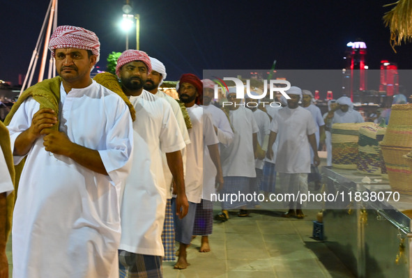 A group of traditional Arabic fishermen performs during the 14th Katara Traditional Dhow Festival in Katara Cultural Village in Doha, Qatar,...