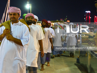 A group of traditional Arabic fishermen performs during the 14th Katara Traditional Dhow Festival in Katara Cultural Village in Doha, Qatar,...