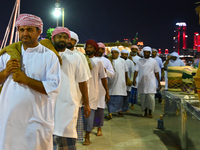 A group of traditional Arabic fishermen performs during the 14th Katara Traditional Dhow Festival in Katara Cultural Village in Doha, Qatar,...