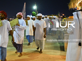 A group of traditional Arabic fishermen performs during the 14th Katara Traditional Dhow Festival in Katara Cultural Village in Doha, Qatar,...