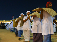 A group of traditional Arabic fishermen performs during the 14th Katara Traditional Dhow Festival in Katara Cultural Village in Doha, Qatar,...