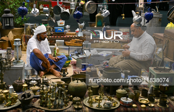 A man makes handicrafts during the 14th Katara Traditional Dhow Festival in Katara Cultural Village in Doha, Qatar, on December 5, 2024. The...