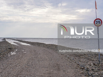 A gravel road by the Wadden Sea bottom connects Jutland and Mando Island. It opens only a few hours daily during low tide due to the high se...