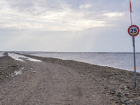 A gravel road by the Wadden Sea bottom connects Jutland and Mando Island. It opens only a few hours daily during low tide due to the high se...