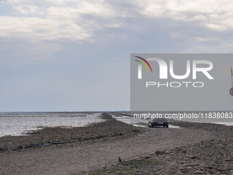 A gravel road by the Wadden Sea bottom connects Jutland and Mando Island. It opens only a few hours daily during low tide due to the high se...