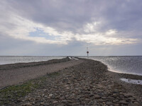 A gravel road by the Wadden Sea bottom connects Jutland and Mando Island. It opens only a few hours daily during low tide due to the high se...