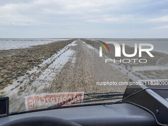 A gravel road by the Wadden Sea bottom connects Jutland and Mando Island. It opens only a few hours daily during low tide due to the high se...