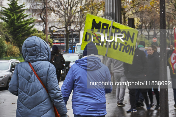 A protester holds a sign about Macron's destitution, in Paris, France, on december 05, 2024. ( Tony Linke/NurPhoto)