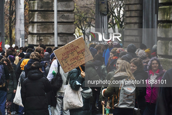 A protester holds a sign against the former minister Kasbarian, in Paris, France, on december 05, 2024. ( Tony Linke/NurPhoto)