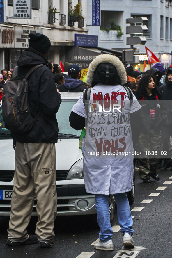 A protester wears a political message, in Paris, France, on december 05, 2024. ( Tony Linke/NurPhoto)