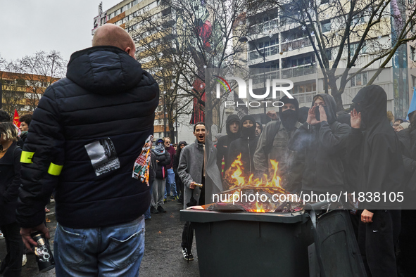 Protesters burn a dustbin, in Paris, France, on december 05, 2024. ( Tony Linke/NurPhoto)