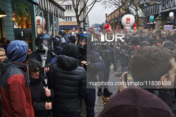 Police push a protester, in Paris, France, on december 05, 2024. ( Tony Linke/NurPhoto)