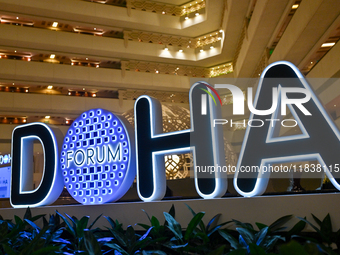 The Doha Forum logo is inside the Sheraton Grand Doha Resort & Convention Hotel in Doha, Qatar, on December 5, 2024, ahead of the 22nd editi...