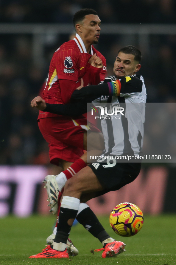 Liverpool's Trent Alexander-Arnold collides with Newcastle United's Bruno Guimaraes during the Premier League match between Newcastle United...