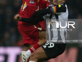 Liverpool's Trent Alexander-Arnold collides with Newcastle United's Bruno Guimaraes during the Premier League match between Newcastle United...