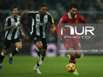 Liverpool's Dominik Szoboszlai breaks away from Newcastle United's Joelinton during the Premier League match between Newcastle United and Li...