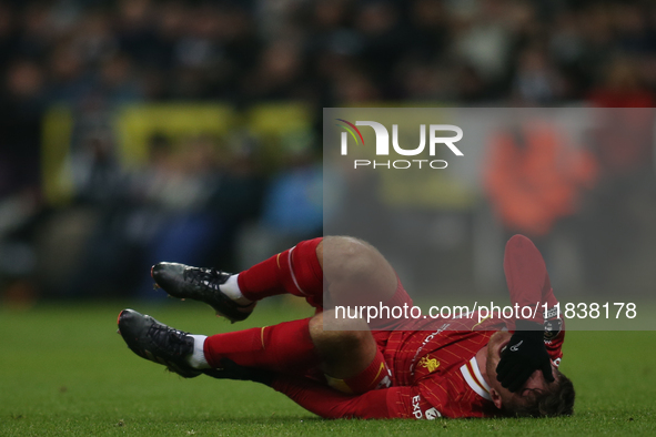 Liverpool's Alexis Mac Allister rolls on the floor during the Premier League match between Newcastle United and Liverpool at St. James's Par...