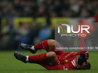 Liverpool's Alexis Mac Allister rolls on the floor during the Premier League match between Newcastle United and Liverpool at St. James's Par...