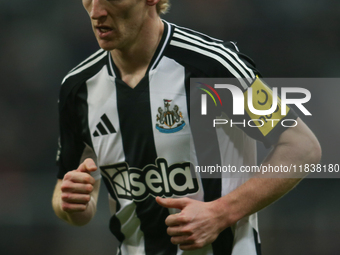 Anthony Gordon of Newcastle United participates in the Premier League match between Newcastle United and Liverpool at St. James's Park in Ne...