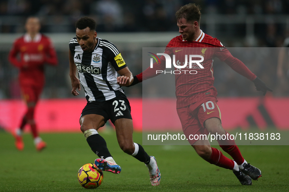 Liverpool's Alexis Mac Allister challenges Newcastle United's Jacob Murphy during the Premier League match between Newcastle United and Live...