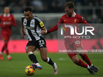 Liverpool's Alexis Mac Allister challenges Newcastle United's Jacob Murphy during the Premier League match between Newcastle United and Live...