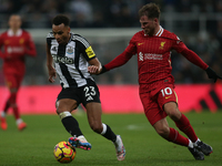 Liverpool's Alexis Mac Allister challenges Newcastle United's Jacob Murphy during the Premier League match between Newcastle United and Live...