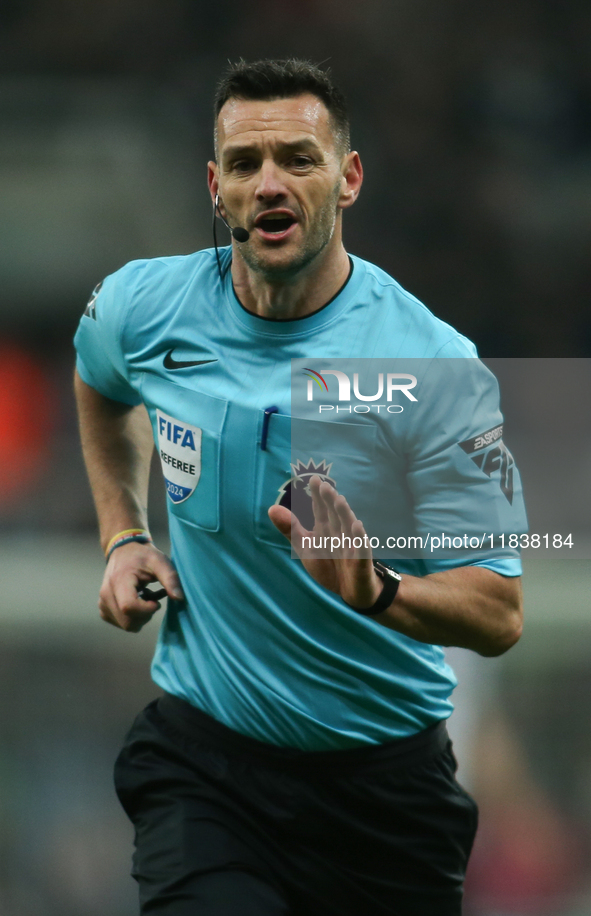 Referee Andy Madley officiates the Premier League match between Newcastle United and Liverpool at St. James's Park in Newcastle, United King...