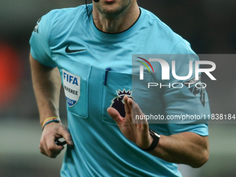 Referee Andy Madley officiates the Premier League match between Newcastle United and Liverpool at St. James's Park in Newcastle, United King...